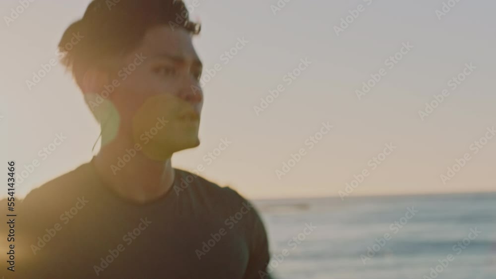 Running, music and beach of man in fitness training for speed, energy and competition with wellness, podcast or mental health audio. Earphones, sea and sports runner with exercise, cardio or workout Running, music and beach of man in fitness training for speed, energy and competition with wellness, podcast or mental health audio. Earphones, sea and sports runner with exercise, cardio or workout