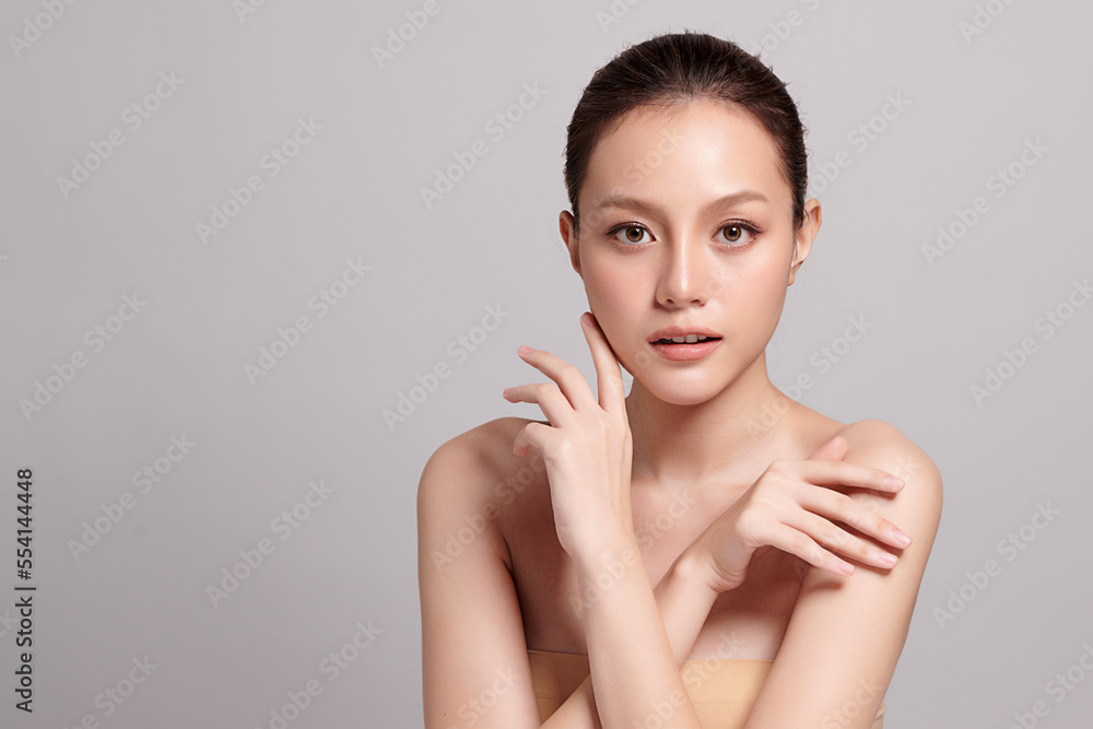 Beautiful young asian woman with clean fresh skin on grey background, Face care, Facial treatment, Cosmetology, beauty and spa, Asian women portrait. Beautiful young asian woman with clean fresh skin on grey background, Face care, Facial treatment, Cosmetology, beauty and spa, Asian women portrait.