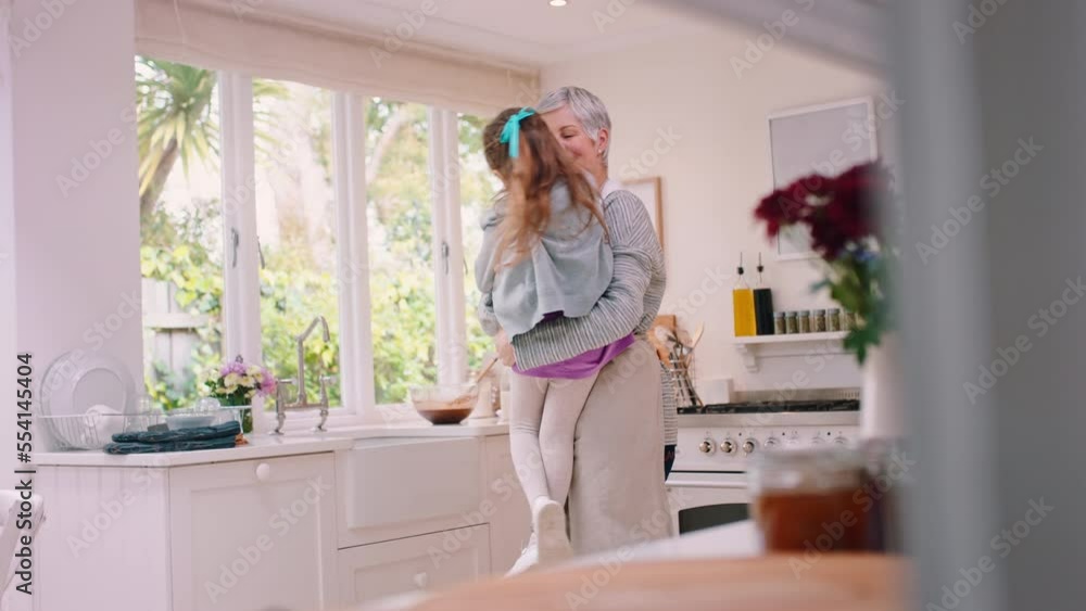 Family, love and excited with a girl and grandma bonding together in a kitchen of their home during a visit. Happy, smile and children with a senior woman and female grandchild hugging in a house Family, love and excited with a girl and grandma bonding together in a kitchen of their home during a visit. Happy, smile and children with a senior woman and female grandchild hugging in a house