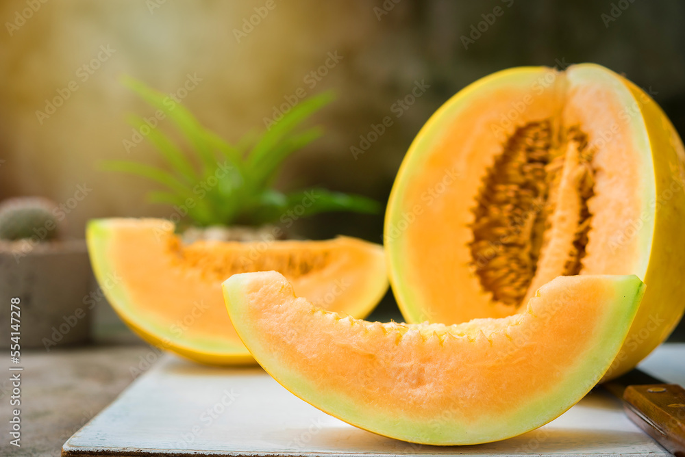 sliced of melons, fresh Melon or cantaloupe, Cantaloupe melons on wood background, Favorite fruit in summer