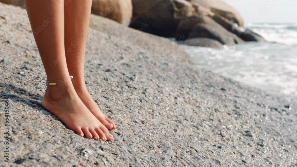 Feet, woman and sea rock of a person by the ocean on summer vacation ...