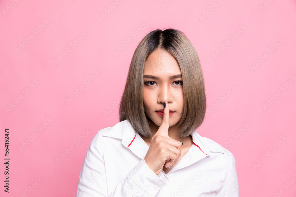 Shh shy sly people person modern concept. Close up portrait of cute lovely attractive uncertain unsure with stylish hairdo entrepreneur making hush gesture isolated on pink background Shh shy sly people person modern concept. Close up portrait of cute lovely attractive uncertain unsure with stylish hairdo entrepreneur making hush gesture isolated on pink background