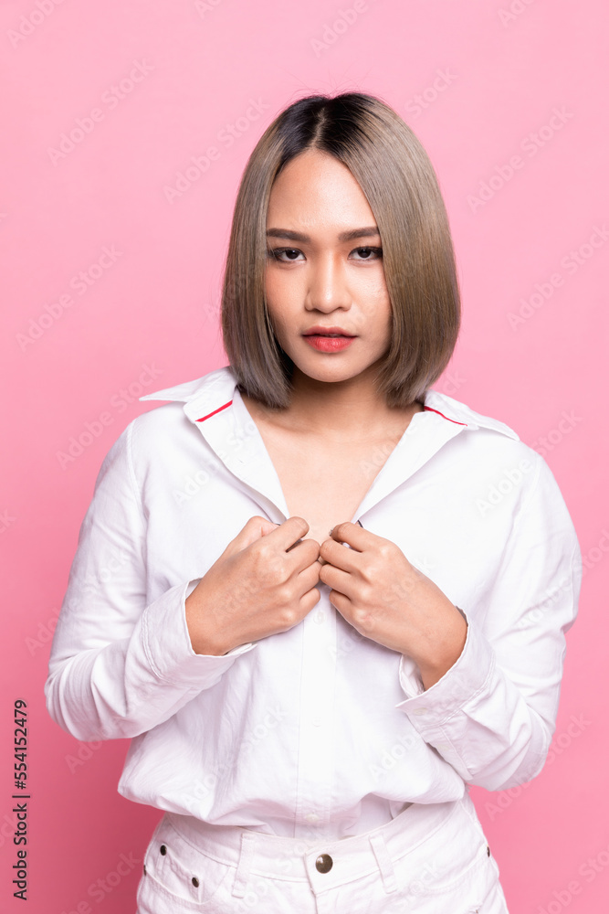 Portrait attractive asian woman feeling happy in front of a bright pink background. Portrait attractive asian woman feeling happy in front of a bright pink background.