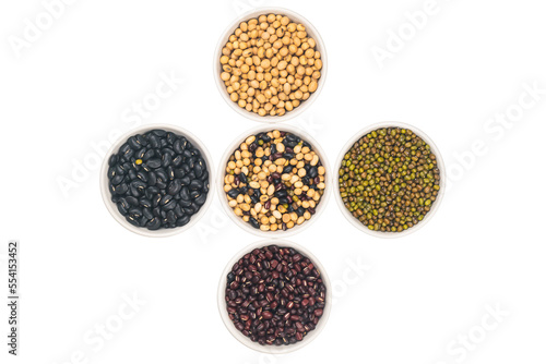 Top view of various dry organic beans in white ceramic bowl isolated on white background with clipping path.