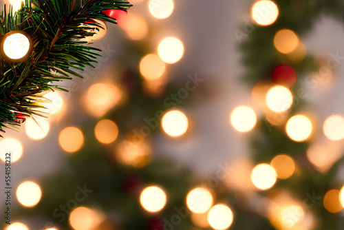 CHRISTMAS DECORATION ON CHRISTMAS BRANNCH WITH BOKEH LIGHTS BACKGROUND