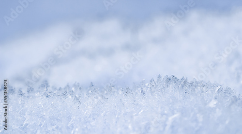 Fresh snow background. Natural winter backdrop. Texture in blue tones