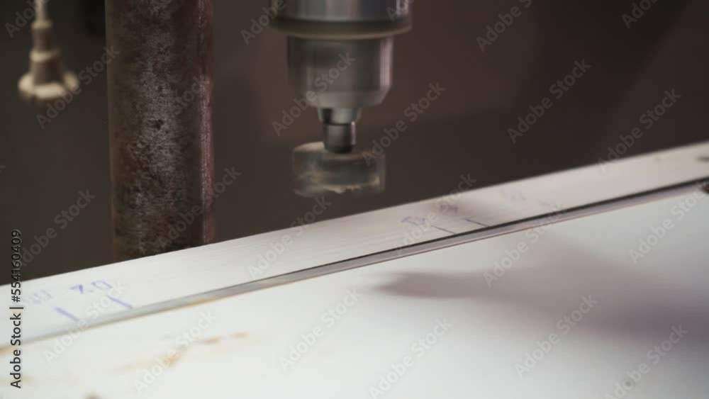 Milling the hole in wood. Worker with milling cutter in action. Countersink drill bit make sink in hole. Man uses drilling machine to make a hole on wooden plank. Milling the hole in wood. Worker with milling cutter in action. Countersink drill bit make sink in hole. Man uses drilling machine to make a hole on wooden plank.