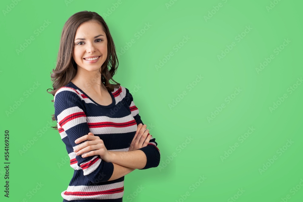 Happy beautiful young woman posing on the background Happy beautiful young woman posing on the background