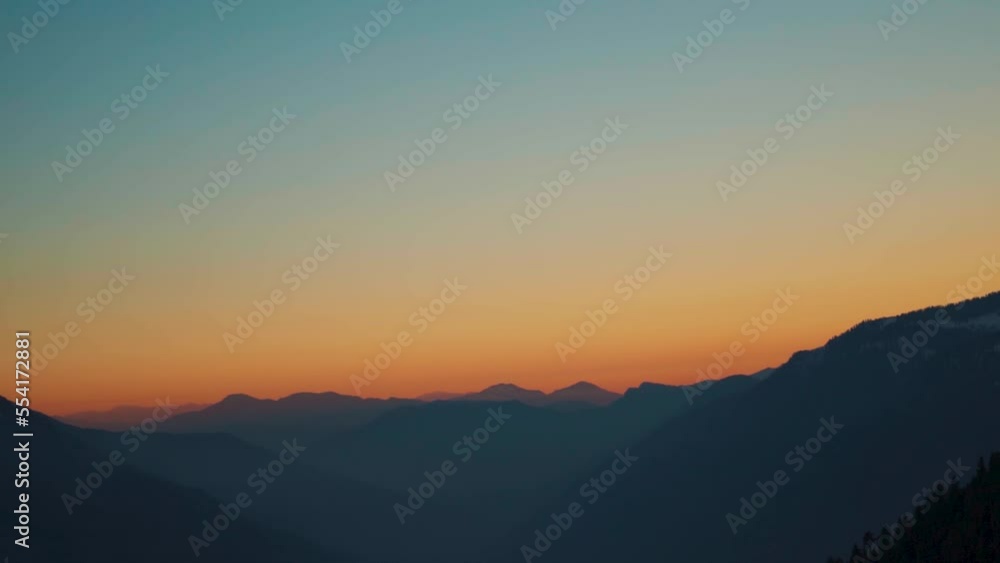 Silhouette shot of foggy mountain layers of the Himalayan mountain range during the sunset at Manali in Himachal Pradesh, Inida. View of the mountain ranges as seen from the top of mountain at sunset. Silhouette shot of foggy mountain layers of the Himalayan mountain range during the sunset at Manali in Himachal Pradesh, Inida. View of the mountain ranges as seen from the top of mountain at sunset.