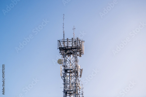 Radio, communication and cell tower on blue sky background. Australia