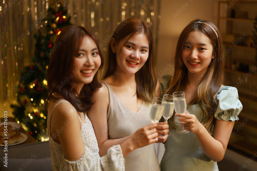 New Year celebration concept, Young beautiful group clinking champagne to celebrating in party
