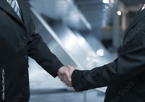 Businessmen handshake on city background, investment concept © BillionPhotos.com