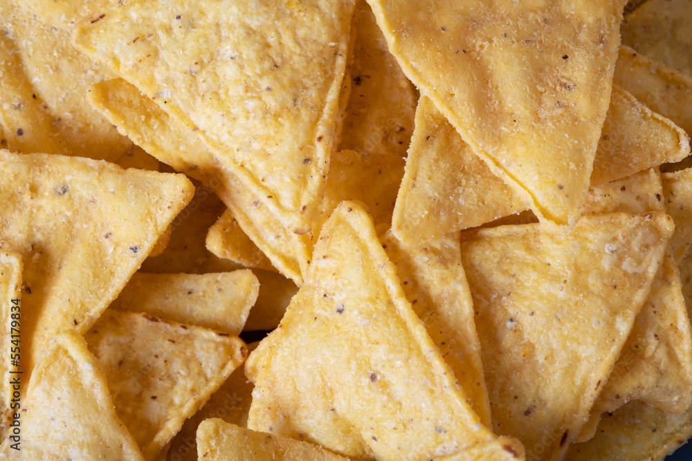 Spicy corn chips nacho close-up, macro shooting. Mexican cuisine. Spicy corn chips nacho close-up, macro shooting. Mexican cuisine.