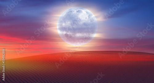 Fototapeta Naklejka Na Ścianę i Meble -  Beautiful sand dunes in the Sahara desert at sunrise with super full moon - Sahara, Morocco 