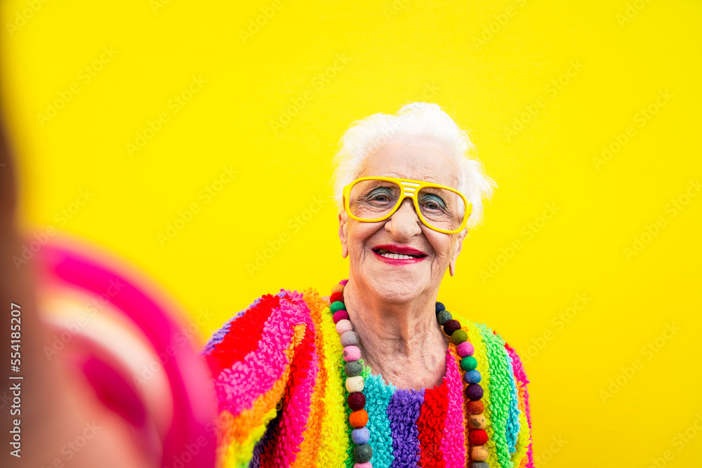 © oneinchpunch - Funny grandmother portraits. Senior old woman dressing elegant for a special event. granny fashion model on colored backgrounds © oneinchpunch - Funny grandmother portraits. Senior old woman dressing elegant for a special event. granny fashion model on colored backgrounds