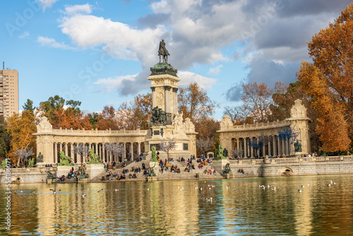 Madrid, monument to Alfonso XII (King of Spain) in Buen Retiro Park (Parque del Buen Retiro) with the small lake and the public park. Community of Madrid, Spain, southern Europe.