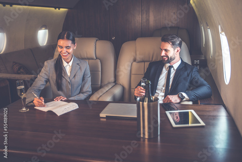 Business team on the private jet photo