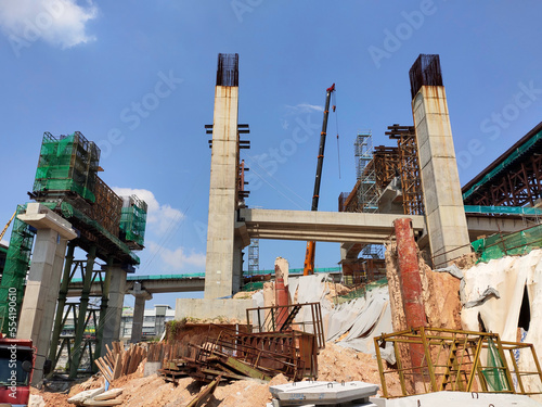 SELANGOR, MALAYSIA -JULY 6, 2022: An elevated road is under construction. Reinforced concrete is used for the structure. Construction is done in stages according to the sequence of works.