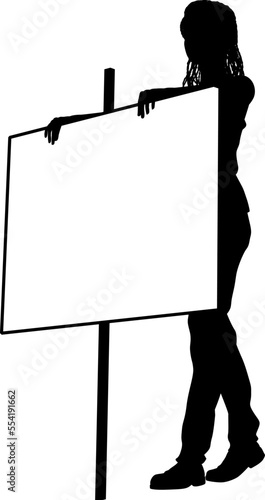 Protestor or demonstrator at a demonstration march, picket line or strike protest rally in silhouette. Holding up a banner or picket sign board placard.