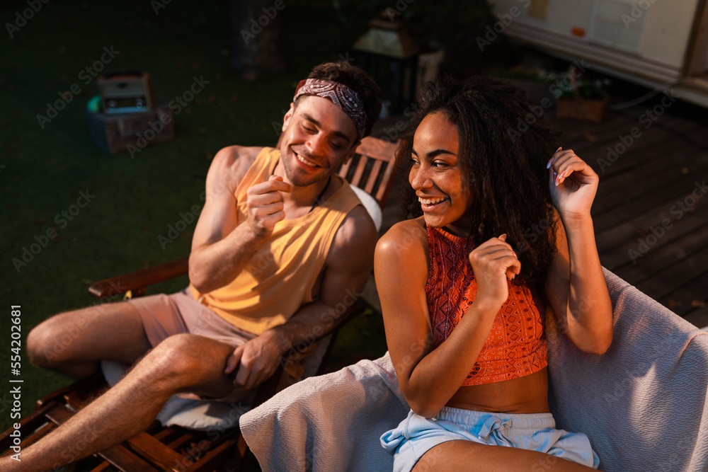 Obraz premium Young couple on vacation with the camper. Concept about wanderlust road trips and lifestyle on vacation