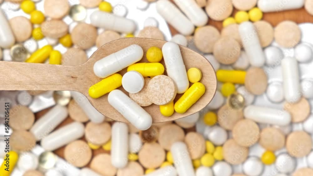 Medicine Pills Background Rotation. Various Medicinal Capsules and Tablets for Health Turning on Turntable. Food supplements and Vitamins. Antiviral, pharmaceutical products. Top view, Flat lay. 4K Medicine Pills Background Rotation. Various Medicinal Capsules and Tablets for Health Turning on Turntable. Food supplements and Vitamins. Antiviral, pharmaceutical products. Top view, Flat lay. 4K