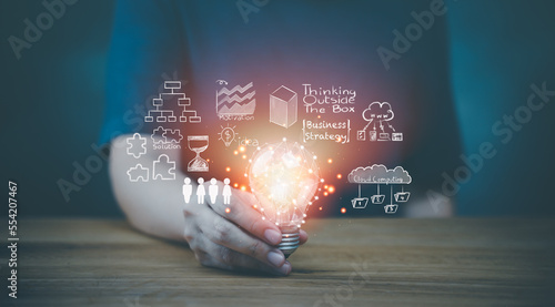 Concept Innovation, inspiration, creative solution idea for modern business intelligence technology. Success creativity invention, thinking imagination digital marketing online. Hand hold light blub.