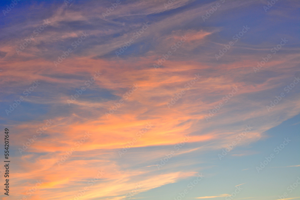 blue sky with red and orange clouds isolated, close-up