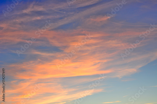 blue sky with red and orange clouds isolated, close-up © Irina