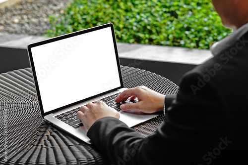 Selective focus of Businesssman hand touching button on Laptop keyboard. Man using computer notebook with blank screen. Man working on laptop computer with two hands. business concept background. photo