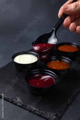 sauces of Asian cuisine on a black background 