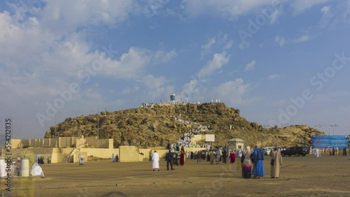 Time lapse of Muslims at Mount Arafat (or Jabal Rahmah) in Arafat, Saudi Arabia. This is the place where Adam and Eve met after being overthrown from heaven. Prores 4KUHD Timelapse. photo