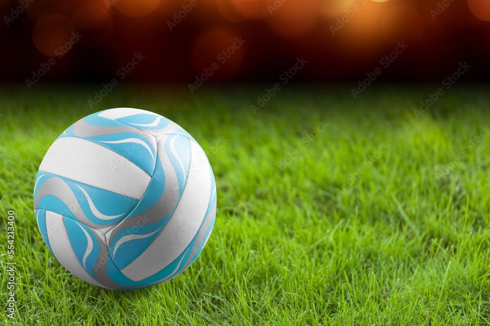 Original football or volleyball on grass at stadium Original football or volleyball on grass at stadium