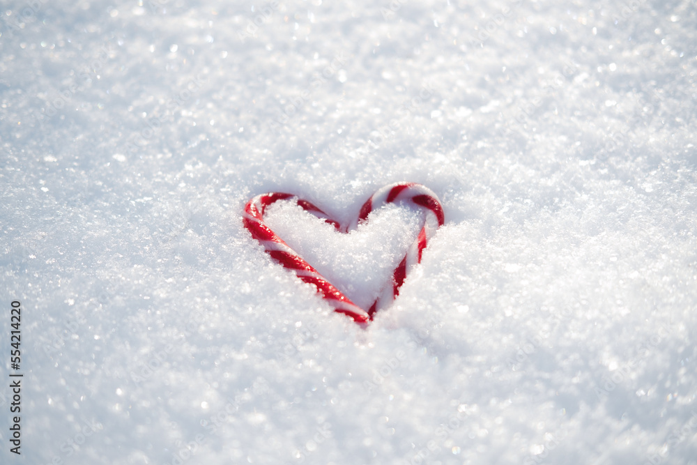 Valentines day, love, romantic web banner with red candy heart on white snow. Valentines day background outdoors. Copy space.