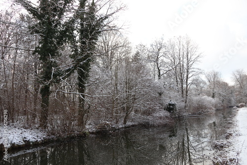 Trees and river in Munich in winter