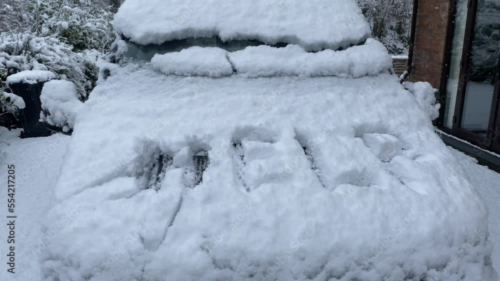 Campervan with snowing scene, showing a sign with Help. Campervan with snowing scene, showing a sign with Help.
