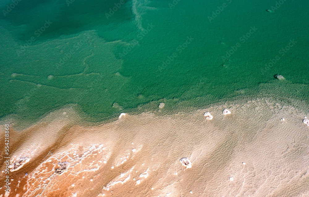 The salts and waters of the Dead Sea. Aerial view. Drone photography