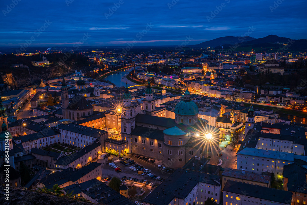 Fototapeta premium Aerial view of Salzburg at dusk from Hohensalzburg Fortress walls, Austria