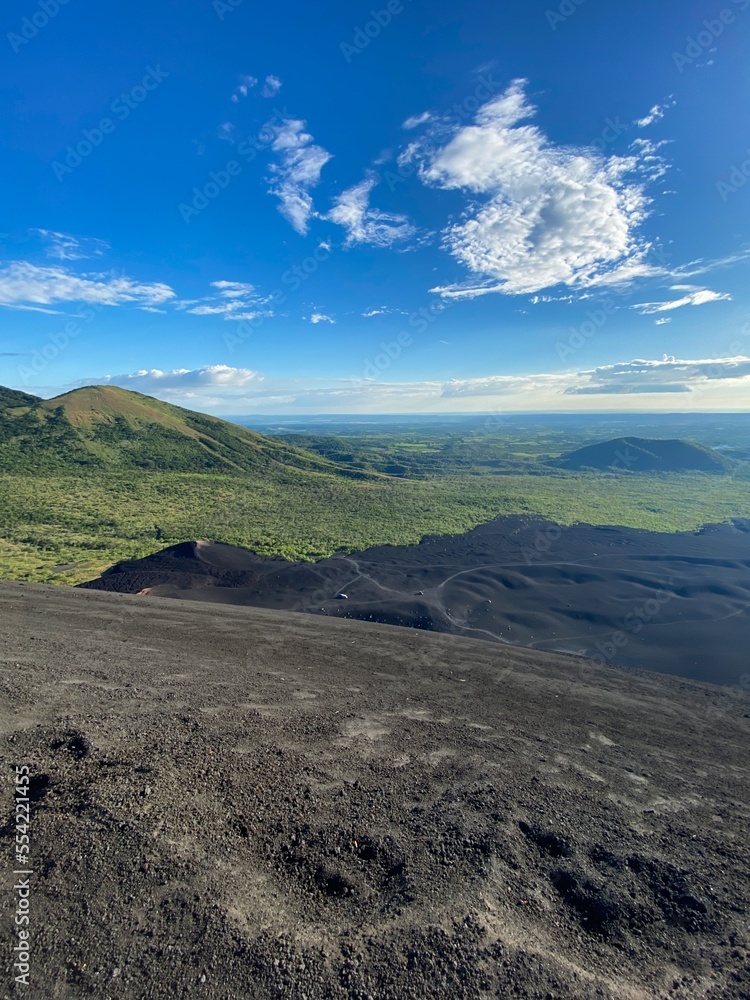 Stunning view from the top of 'Cerro Negro' volcano close to Leon, Nicaragua. View of beautifully shaped volcanos and hills. Beautiful volcano landscape in Nicaragua. Black volcanic rocks. Stunning view from the top of 'Cerro Negro' volcano close to Leon, Nicaragua. View of beautifully shaped volcanos and hills. Beautiful volcano landscape in Nicaragua. Black volcanic rocks.
