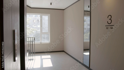Modern entrance with white walls. Stock footage. Third floor of a modern new hall in a multi storey building.