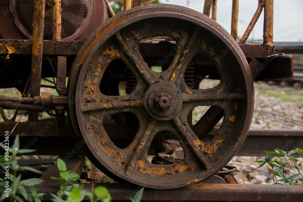 Close-up of an old tram wheel made of iron