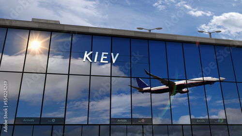 Airplane landing at Kiev Ukraine mirrored in terminal