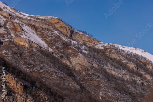 Beautiful Mountain Landscape. Panoramic view of the snow-covered winter mountains of the Greater North Caucasus. Elbrus, Upper Balkaria, Kabardino-Balkaria, Russia.