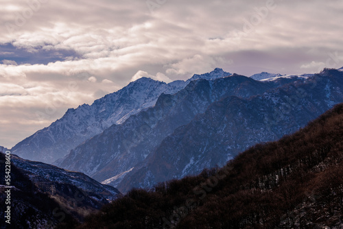Fototapeta Naklejka Na Ścianę i Meble -  Beautiful  Mountain Landscape. Panoramic view of the snow-covered winter mountains of the Greater North Caucasus. Elbrus, Upper Balkaria, Kabardino-Balkaria, Russia.