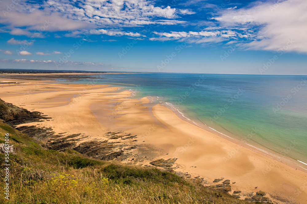 Scene of beach side with cloudy sky, saturated colors Scene of beach side with cloudy sky, saturated colors