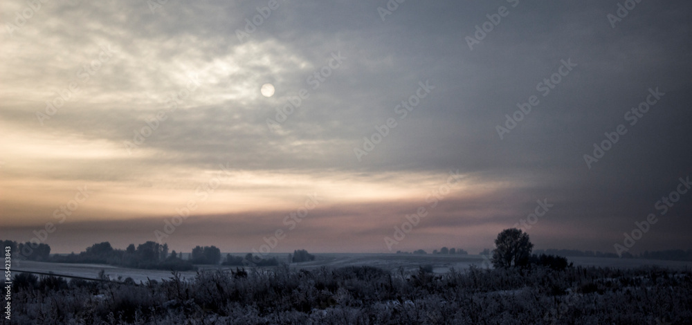 Naklejka premium winter sunset in the sky win
