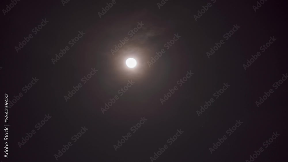 Timelapse of Moon at night in the sky with moving clouds Timelapse of Moon at night in the sky with moving clouds