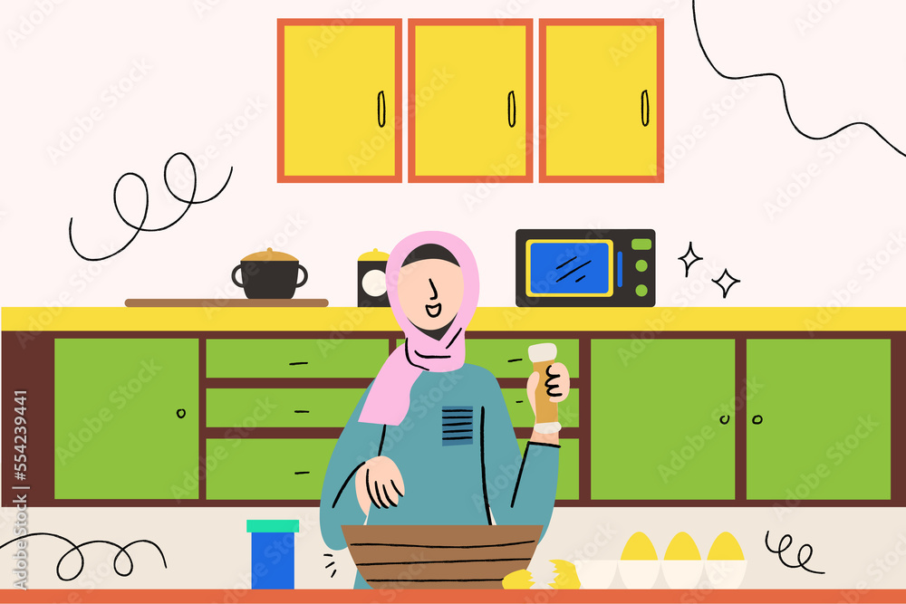 Asian hijab woman cooking in the kitchen
