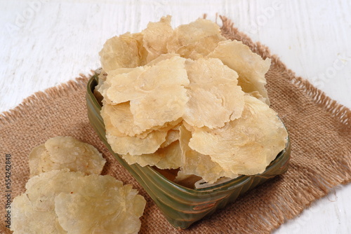 emping mlinjo . Indonesian chips, bite-sized snack crackers, are made from melinjo or belinjo nuts (Gnetum gnemon) photo