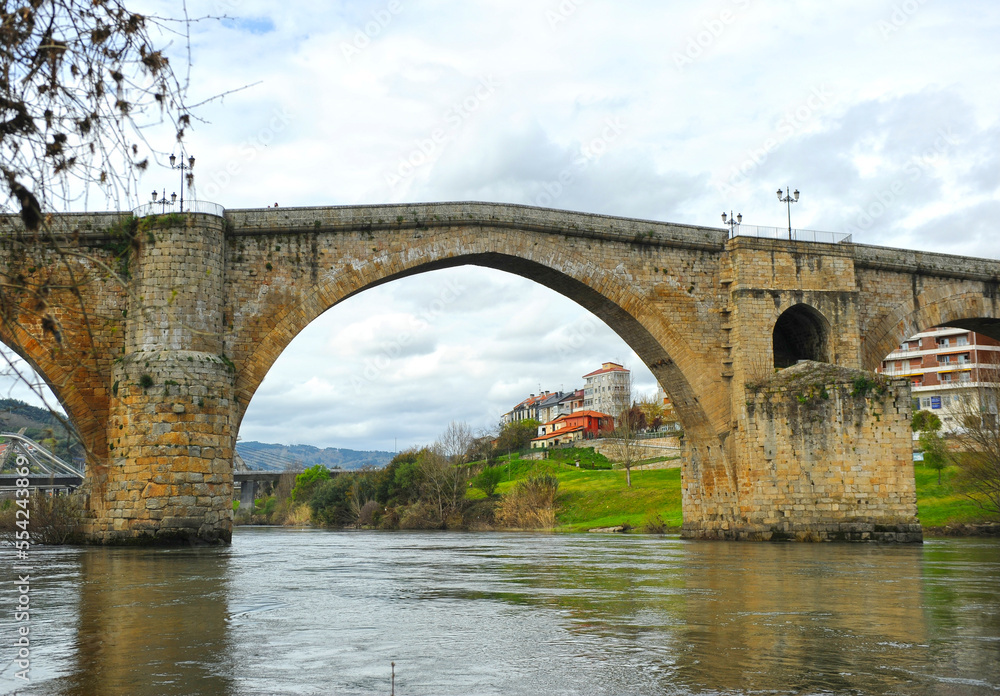 The Old Bridge (Ponte Vella) or Major Bridge (Ponte Maior) over the Minho river in Ourense, Galicia, Spain. Ourense is a city on the Way of Santiago - Via de la Plata