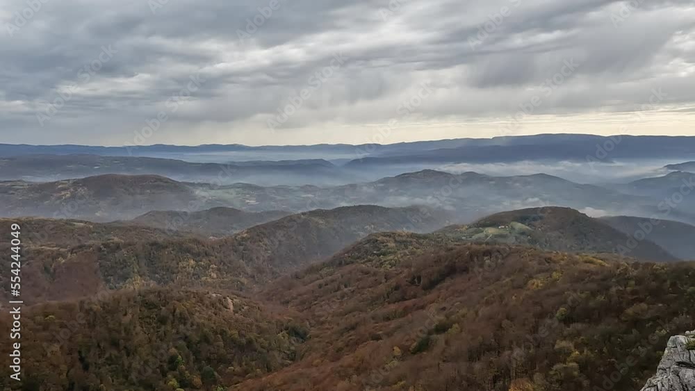 Beautiful view of misty mountain peaks in autumn season in the morning. Nature scenery, fall foggy landscape. Beautiful view of misty mountain peaks in autumn season in the morning. Nature scenery, fall foggy landscape.